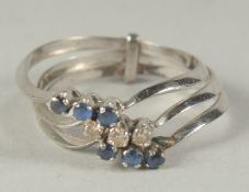 AN 18CT WHITE GOLD TRIPLE RING set with diamonds and sapphires in a box.