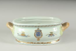 A TWO HANDLED ARMORIAL FOOT BATH. 15ins long.