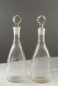 A PAIR OF GEORGIAN ENGRAVED DECANTER AND STOPPER.
