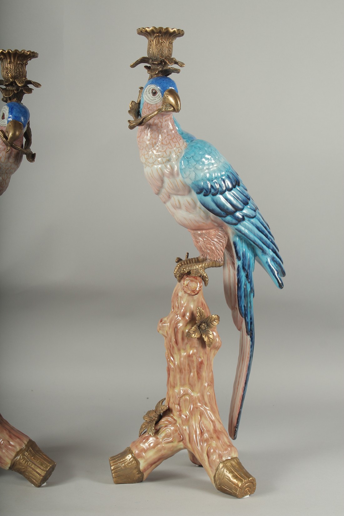 A GOOD PAIR OF BLUE PORCELAIN PARAKEET CANDLESTICKS with gilt metal candle holders, standing on a - Image 3 of 3