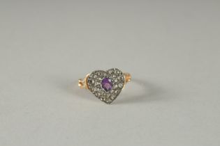 A ROSE GOLD DIAMOND AND AMETHYST HEART SHAPED RING.