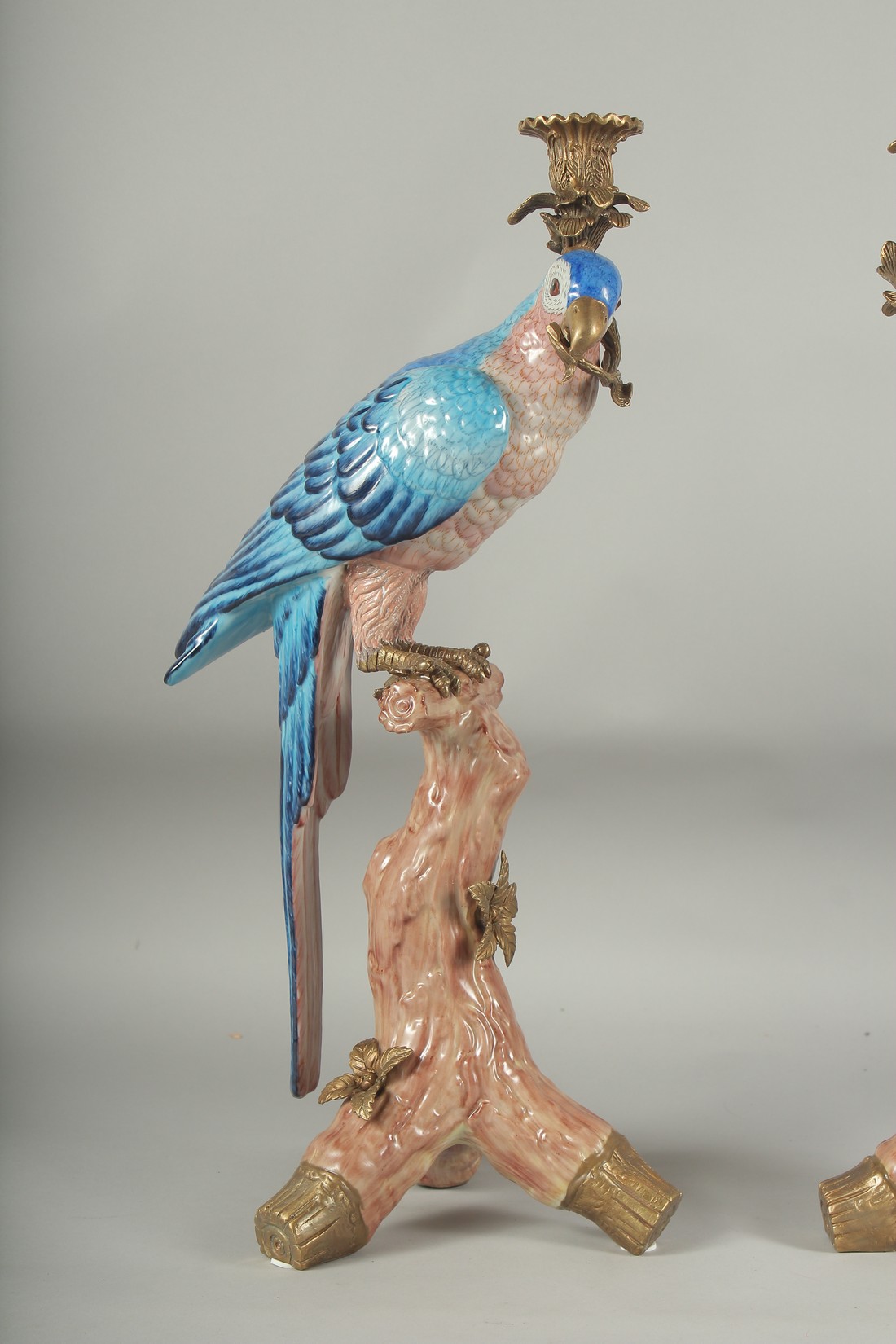 A GOOD PAIR OF BLUE PORCELAIN PARAKEET CANDLESTICKS with gilt metal candle holders, standing on a - Image 2 of 3
