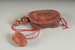 A CARVED HARDWOOD THREE DIVISION TURTLE INRO and fish bead and rope. 4ins.
