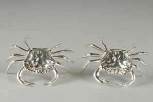 A PAIR OF SILVER PLATED CRAB TABLE SALTS. 4.5ins.