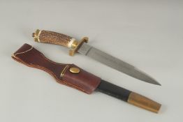 A GERMAN KNIFE with engraved, 8.5ins blade. VIVE LE ROX ET SES CHASSEURS with bone handle, in a