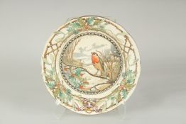A LONGTON STAFFORDSHIRE CHRISTMAS PLATE. The centre with a robin. 12ins diameter.