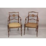 A GOOD PAIR OF REGENCY THOMAS HOPE DESIGN BLACK JAPANNED AND GILDED ARM CHAIRS with rope back,