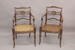 A GOOD PAIR OF REGENCY THOMAS HOPE DESIGN BLACK JAPANNED AND GILDED ARM CHAIRS with rope back,