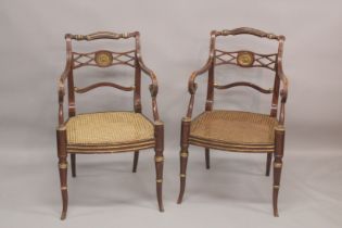 A GOOD PAIR OF REGENCY THOMAS HOPE DESIGN BLACK JAPANNED AND GILDED ARM CHAIRS with rope back,