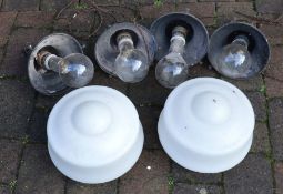 Four industrial hanging lights with two glass shades