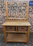 Modern kitchen unit with two wicker basket drawers and hanging rail with hooks