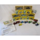 5 boxed Vanguard cars, loose cars including a red Dinky truck and trailer and a Springside model