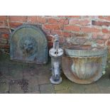 Cast iron lion head water feature over a pocket & water pump