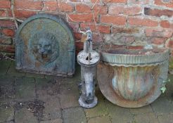 Cast iron lion head water feature over a pocket & water pump