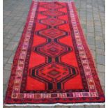 Rich red ground thick pile Persian Meshkin runner 315cm by 116cm