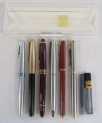 Collection of fountain pens includes Sheaffer, Parker and an empty Exceed pen case