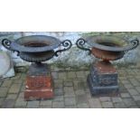 Pair of large cast iron garden urns on pedestals approx. Ht 76cm W 87cm or 60cm excluding the