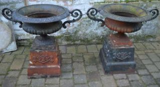 Pair of large cast iron garden urns on pedestals approx. Ht 76cm W 87cm or 60cm excluding the