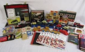 Collection of toys and games including backgammon, Yahtzee, playmobil, card games, note books,