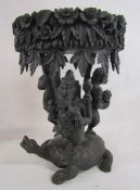 Anglo-Indian ebonised jardinière stand intricately carved top held up by Ganehsa, Hanuman and