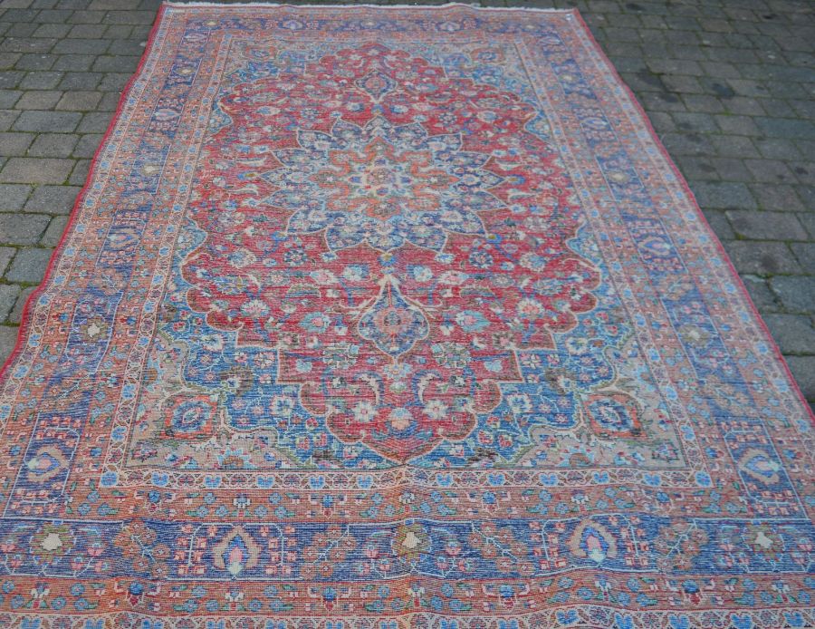 Red ground Persian Mashad carpet with floral medallion 302cm by 195cm - Image 3 of 3