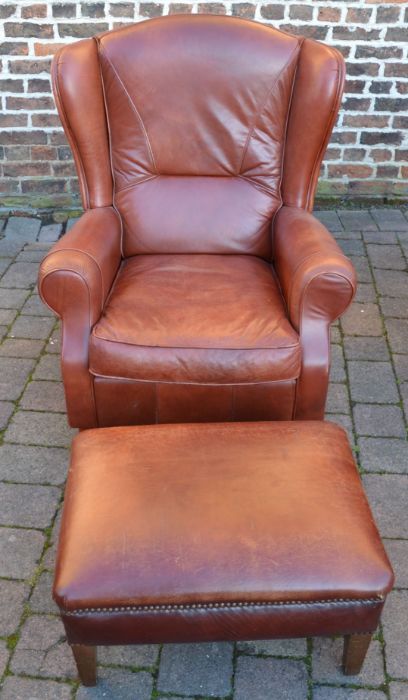 Leather armchair with footstool