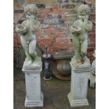 2 concrete cherubs on plinths garden statues approx. 128cm tall