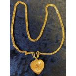 Chinese gold heart shape pendant on a gold chain tested as 18ct. 27g length 42cm