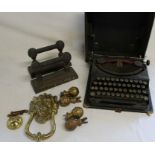 Pair of brass firedogs, brass lion door knocker, brass finials & Remington portable typewriter