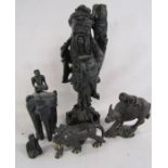 Collection of ebonised wooden carved figures includes water buffalo, elephant, lion and a fisherman