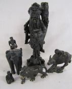 Collection of ebonised wooden carved figures includes water buffalo, elephant, lion and a fisherman
