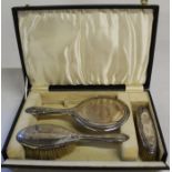 Robert Pringle & Sons cased set silver backed brushes and hand mirror with embossed rosebud pattern,