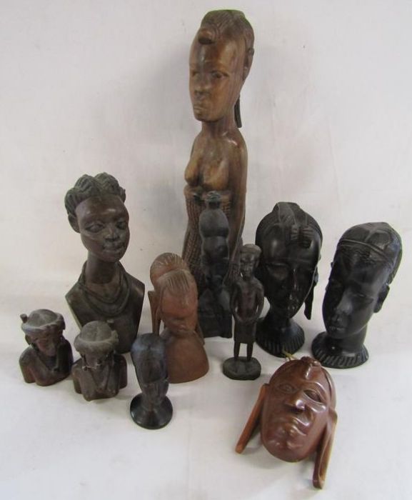 Collection of African carved wooden figures and heads