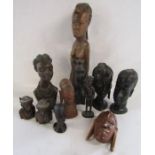 Collection of African carved wooden figures and heads