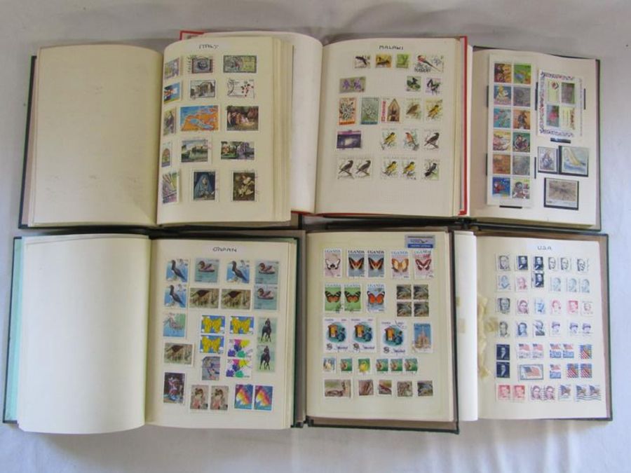 6 stamp albums includes USA, Italy, Japan, France, Malawi etc