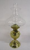 Brass oil lamp with clear glass chimney and shade