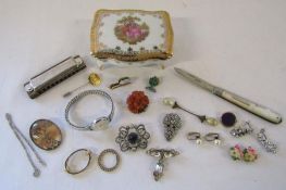 Collection of costume jewellery including miniature Hohner harmonica, brooches and scarf rings,