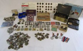 Large collection of coins includes six pences, three pences, Isle of Man first day minting £1 and
