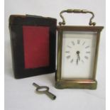 Cased brass carriage clock with key approx. 11cm tall to top of clock