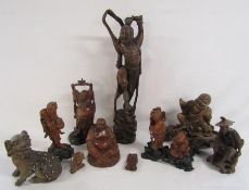 Collection of carved wooden Japanese and Chinese figures includes buddhas, small water buffalo,
