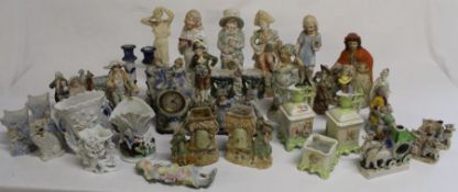 Selection of decorative bisque figurines, fairings, candlesticks etc.