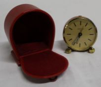 Vintage Looping travel alarm clock with Swiss 15 jewel movement, with red and brass band