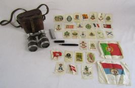 Collection of small collectables including silks of flags,  binoculars in leather case embossed with