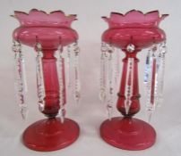 Pair of cranberry glass lustres - missing one round drop approx. 32.5cm tall