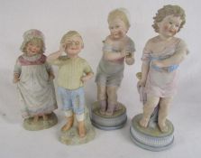4 bisque figures of children - tallest approx. 39cm