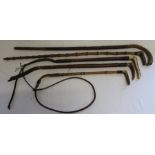 Three vintage riding crops & bamboo walking cane & one other