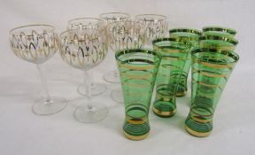 6 balloon wine glasses with gold ballerina design and 6 green glasses with gold banded pattern