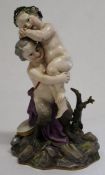 19th century Meissen group of satyr & cherub, embracing and standing on a rocky mound, with