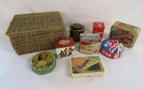 Collection of vintage tins stored in a modern wicker basket includes Walters palm toffee, Butlin's