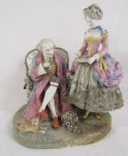 19th Century porcelain figure of sitting man and his wife bearing crossed swords mark possibly